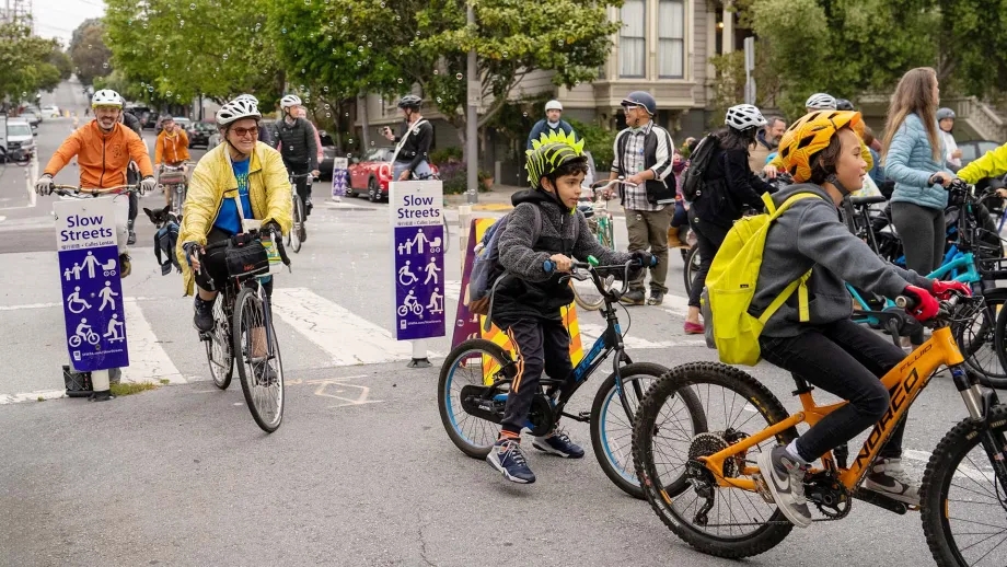 A group of students biking to school during National Bike Month.