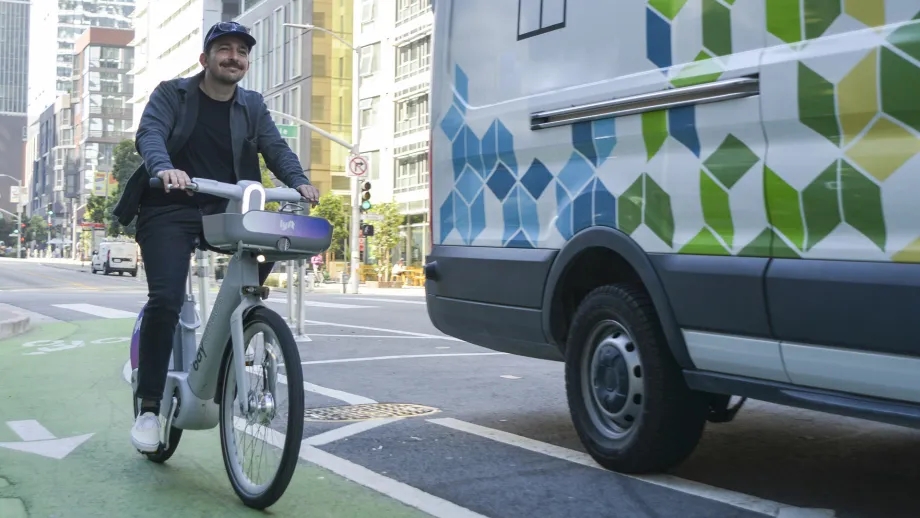 A man riding a Bay Wheels e-bike in San Francisco.