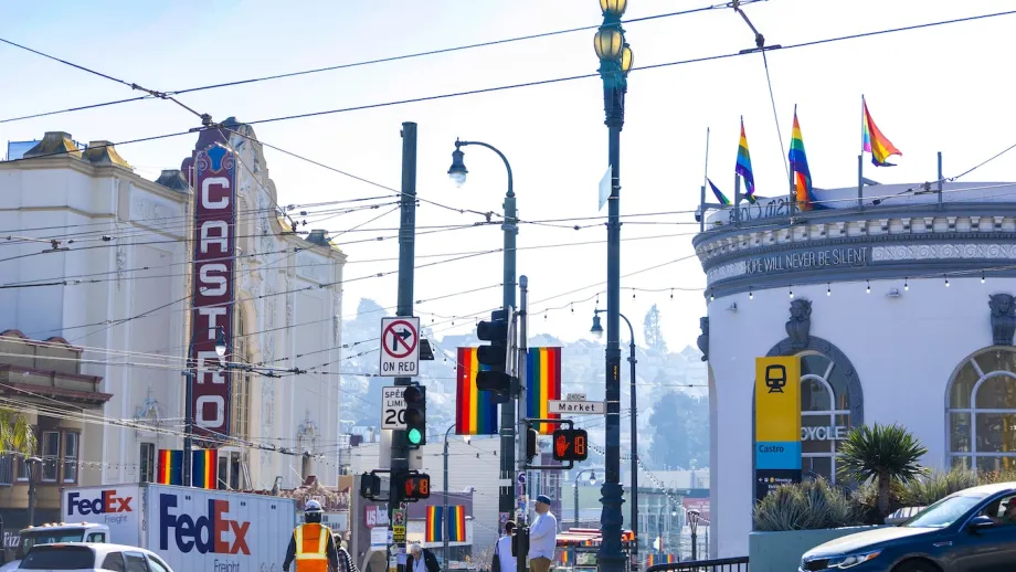 A view of Castro St. with the Castro Theater on the left and a new monolith sign for the Castro Muni Metro station on the right.