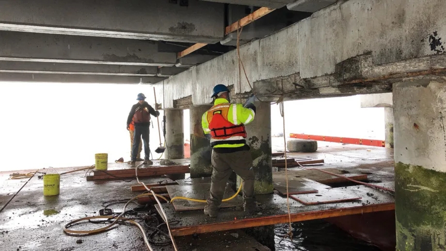 Workers making maintenance repairs on the San Mateo-Hayward Bridge.