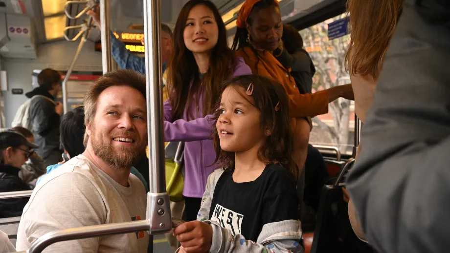 Happy passengers on a Muni light rail train.