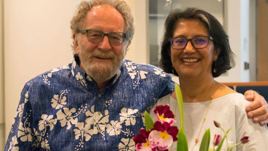 MTC Chair Jake Mackenzie presents MTC Senior Public Information Officer Catalina Alvarado with some flowers at the May 24, 2017 Commission meeting.