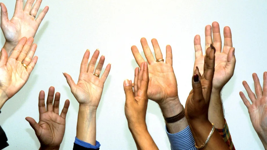 Hands raised in the air.